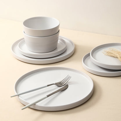 Transform Your Dining Moments with the Celina 16-Piece Mid-Century Modern Dinnerware Set in Chic White Stoneware